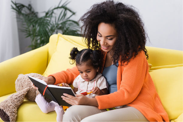 Sensory story time - mother reading to child